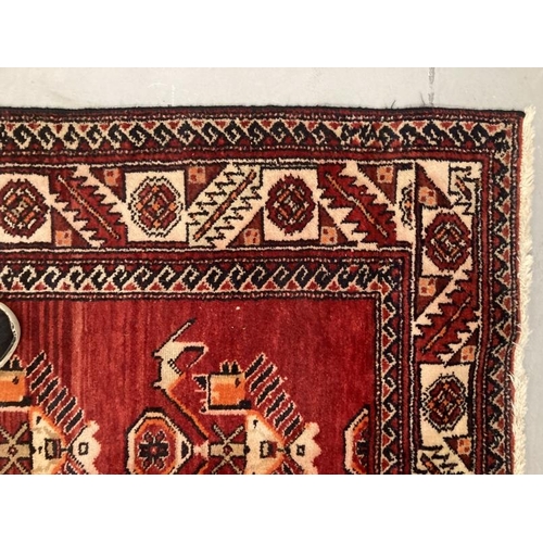 20 - Carpets & Rugs: Late 19th/early 20th cent. Persian carpet, red ground with a central panel containin... 