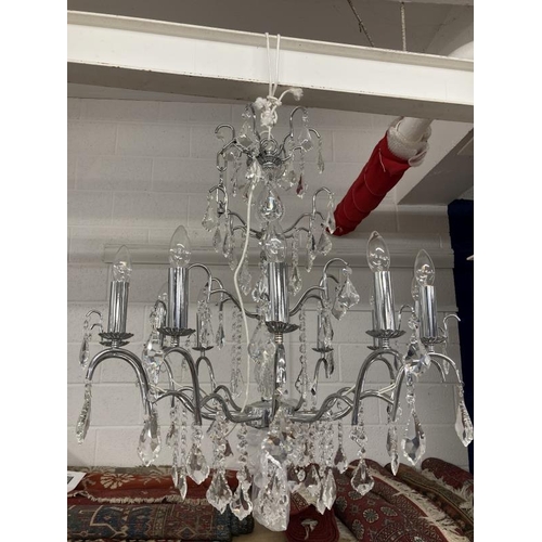 23 - 20th cent. Chromed glass twelve lamp chandelier.