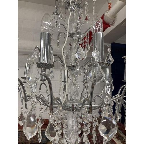 23 - 20th cent. Chromed glass twelve lamp chandelier.