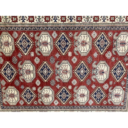 24 - Carpets & Rugs: 20th cent. Caucasian carpet most likely Kazak, red ground, twenty-one large guls plu... 