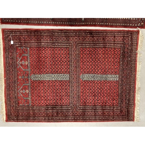 25 - Carpets & Rugs: Early 20th cent. Turkman rug, unusual two rectangular central panels in blues, black... 