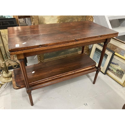 49 - 20th cent. Stained pine tea table with carved supports and two leaves.