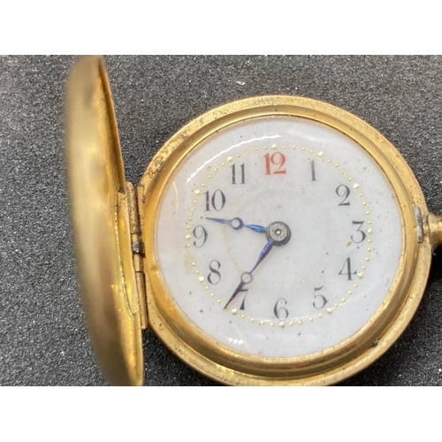 571 - Watches: Half hunter 18ct gold with a Roman numeral ring and the Royal Crown on inside over set in a... 