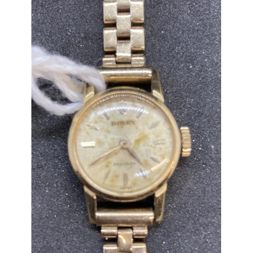 573 - Watches: 9ct yellow gold ladies Rolex Precision wristwatch on a 9ct brick link bracelet.