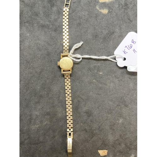 573 - Watches: 9ct yellow gold ladies Rolex Precision wristwatch on a 9ct brick link bracelet.