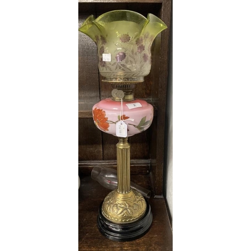 9 - Victorian oil lamp black ceramic base, reeded brass column, pink glass reservoir decorated with flow... 