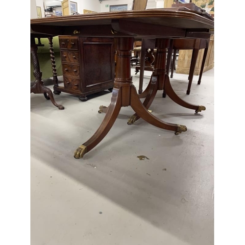 96 - 20th cent. Mahogany two pillar dining table with extra leaf, crossbanded top. 29ins. x 40ins. x 87in... 