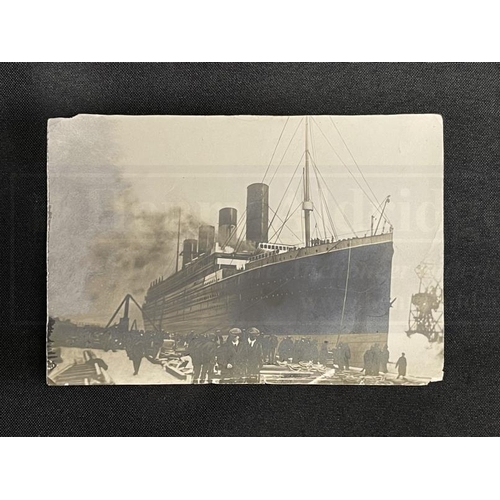 226 - R.M.S. TITANIC: Sepia photograph of Titanic in Belfast, late 1911, the reverse reads 