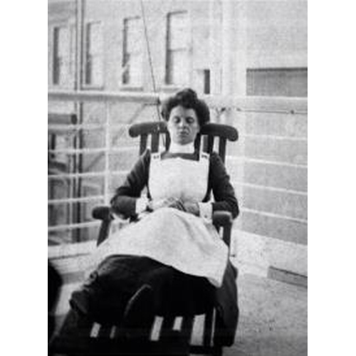 228 - R.M.S. TITANIC: Rare original photograph of Titanic stewardess Annie Martin in uniform, reposing in ... 