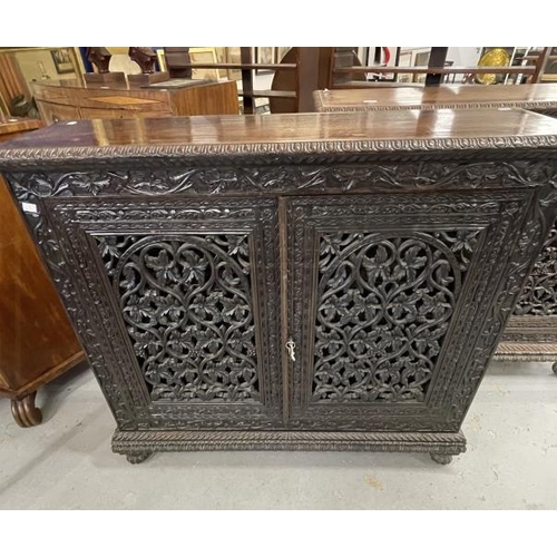 103 - 19th cent. Anglo Indian teak cabinets c1860 with carved and pierced cupboard doors and sides enclosi... 