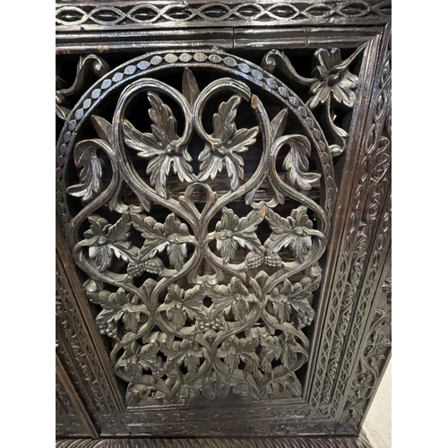 103 - 19th cent. Anglo Indian teak cabinets c1860 with carved and pierced cupboard doors and sides enclosi... 