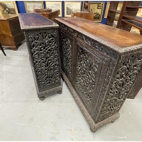 103 - 19th cent. Anglo Indian teak cabinets c1860 with carved and pierced cupboard doors and sides enclosi... 