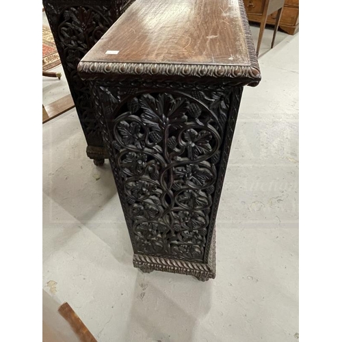 103 - 19th cent. Anglo Indian teak cabinets c1860 with carved and pierced cupboard doors and sides enclosi... 