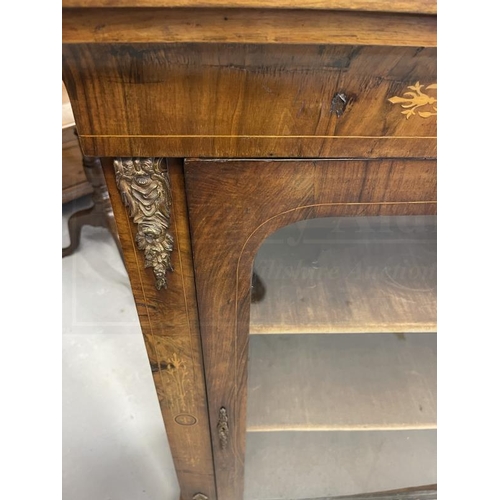 112 - 19th cent. Walnut glazed door cabinet with boxwood inlay and brass mounts to the front on a shaped p... 