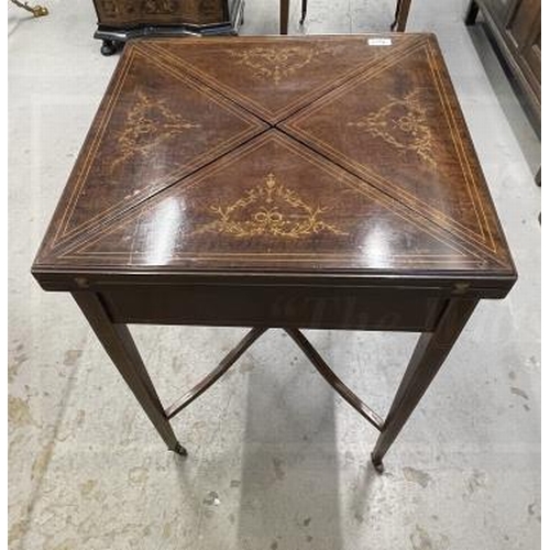 117A - Sheraton Revival mahogany inlaid bridge/envelope table on tapering supports.