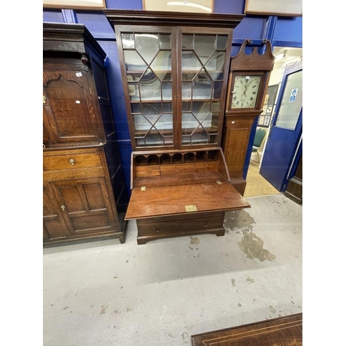 131 - Georgian mahogany bureau bookcase with astragal glass, some panes cracked, and fitted interior. 39in... 