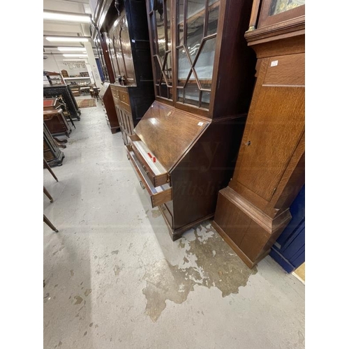 131 - Georgian mahogany bureau bookcase with astragal glass, some panes cracked, and fitted interior. 39in... 