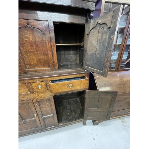 132 - 18th cent. Oak court cupboard the top has three panelled cupboard doors, the lower section with thre... 