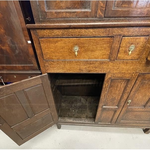 132 - 18th cent. Oak court cupboard the top has three panelled cupboard doors, the lower section with thre... 