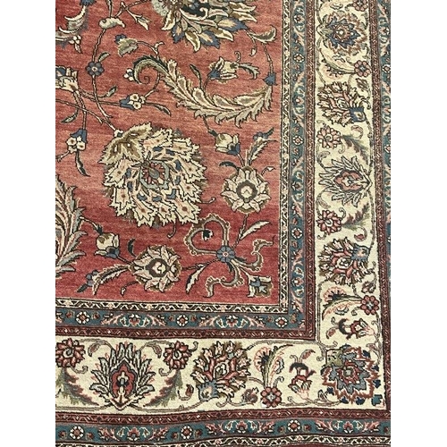 135 - Carpets & Rugs: Early 20th cent. Persian carpet, red ground with floral decoration and seven borders... 