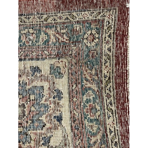 135 - Carpets & Rugs: Early 20th cent. Persian carpet, red ground with floral decoration and seven borders... 