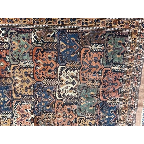 141 - Carpets & Rugs: 19th cent. Kazak rug, multicoloured ground decorated with geometric patterns in ivor... 