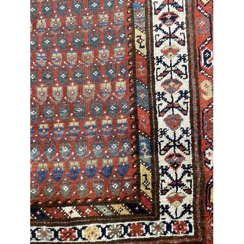 142 - Carpets & Rugs: 19th cent. Persian runner, red ground with stylised floral decoration, four borders ... 