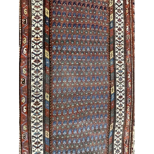 142 - Carpets & Rugs: 19th cent. Persian runner, red ground with stylised floral decoration, four borders ... 