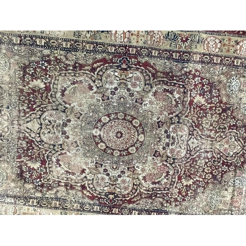 143 - Carpets & Rugs: 19th cent. Persian rug, red ground with stylised floral decoration, four borders all... 