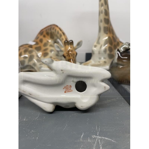 194 - Ceramics: Russian Lomonosov figures, a seated giraffe head bent down marked Made U.S.S.R. 5½ins. x 1... 