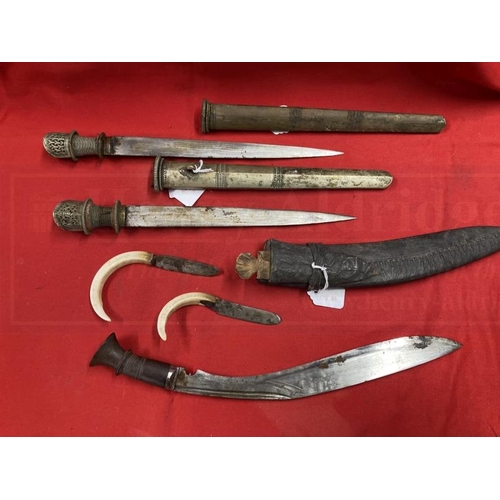 250 - Edged Weapons: Indian Kukri knife set, leather scabbard with a wooden hilt 16ins, two small knives w... 