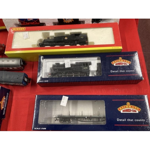 338 - Toys: Hornby OO trains one boxed set, one cased set with tracks and various carriages, etc.