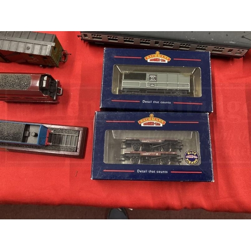 338 - Toys: Hornby OO trains one boxed set, one cased set with tracks and various carriages, etc.