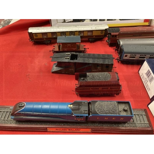 338 - Toys: Hornby OO trains one boxed set, one cased set with tracks and various carriages, etc.