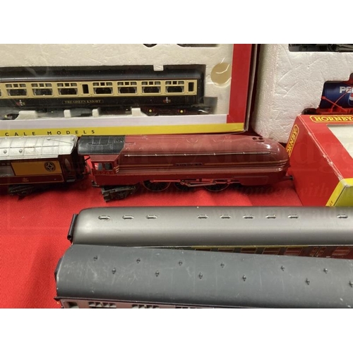 338 - Toys: Hornby OO trains one boxed set, one cased set with tracks and various carriages, etc.