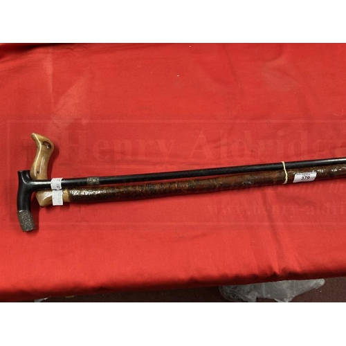 379 - 19th cent. Ebony and silver banded walking cane plus rustic example. (2)