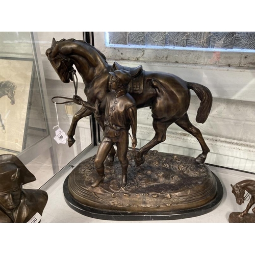 385 - 20th cent. Bronze figure of a racehorse and jockey on a marble base, signed and dated. 18½ins.