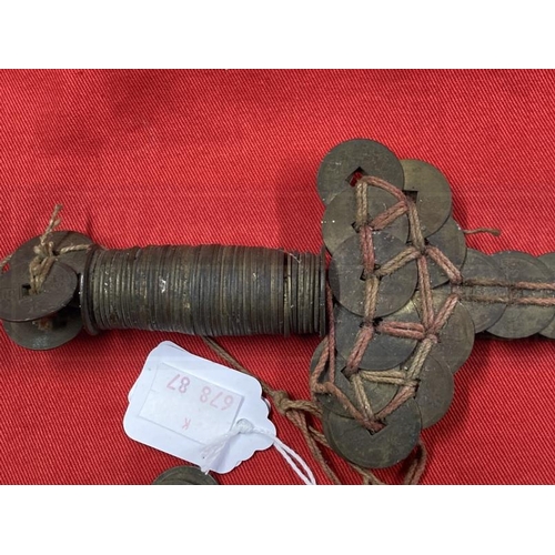 395 - Weapons: Chinese coin sword, iron roil with Chinese coins of the 19th cent. tied to it with red and ... 