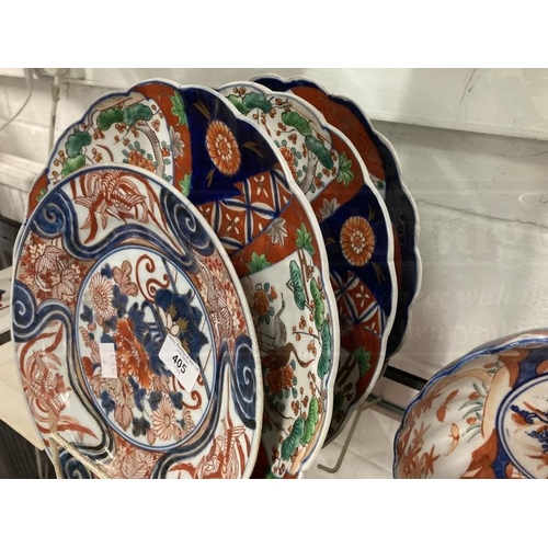 405 - Ceramics/Asian: Mixed lot to include a pair of Imari chargers 11¾ins, another Imari charger, plate, ... 