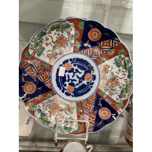 405 - Ceramics/Asian: Mixed lot to include a pair of Imari chargers 11¾ins, another Imari charger, plate, ... 