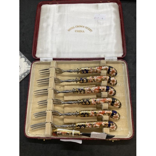 433 - Royal Crown Derby Imari pattern fruit forks with porcelain handles, cased set of six, and a butter k... 