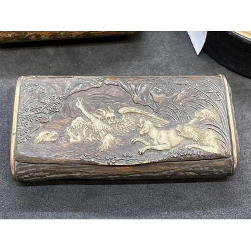 470 - Snuffboxes: 19th cent. Pressed wood snuff box with a hunting scene carved in bone of dogs attacking ... 