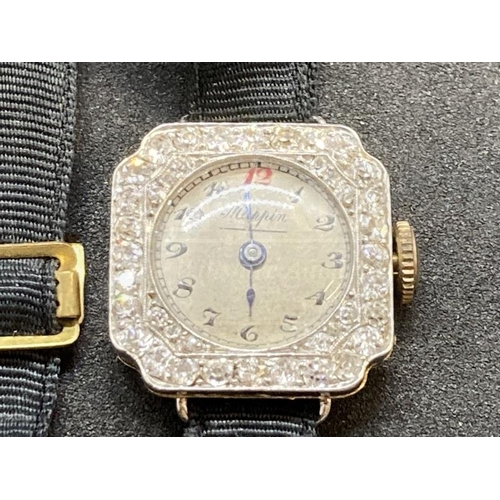 497 - Watches: 18ct gold and platinum ladies diamond set by Mappin attached to a Moira band. Estimated tot... 