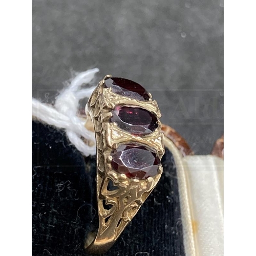 502 - Hallmarked Jewellery: 9ct gold ring set with three oval cut garnets, estimated weight of (3) 3.00ct,... 