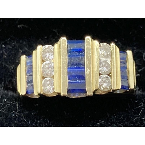 518 - Jewellery: 14ct gold diamond and sapphire articulated bracelet stamped 14K. Set with thirty-eight di... 