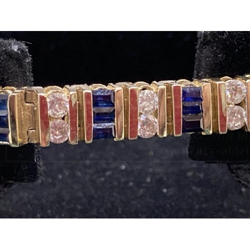 518 - Jewellery: 14ct gold diamond and sapphire articulated bracelet stamped 14K. Set with thirty-eight di... 