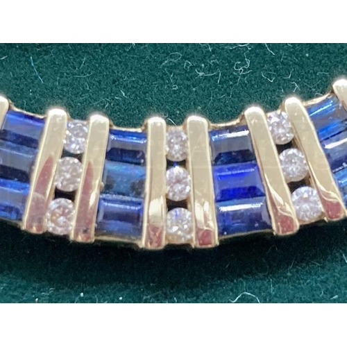 518 - Jewellery: 14ct gold diamond and sapphire articulated bracelet stamped 14K. Set with thirty-eight di... 