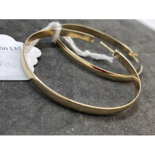 524 - Hallmarked Jewellery: Pair of 9ct gold large hoop earrings. Dia. 2¼ins. Weight 9.4oz.