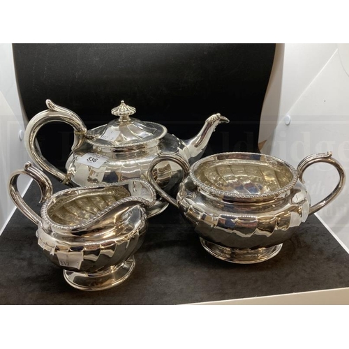 536 - Hallmarked Silver: Georgian three piece tea set melon pattern body, gadroon border, C scroll handle.... 