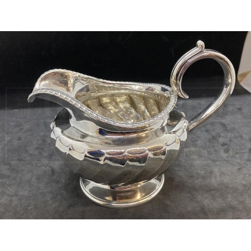 536 - Hallmarked Silver: Georgian three piece tea set melon pattern body, gadroon border, C scroll handle.... 